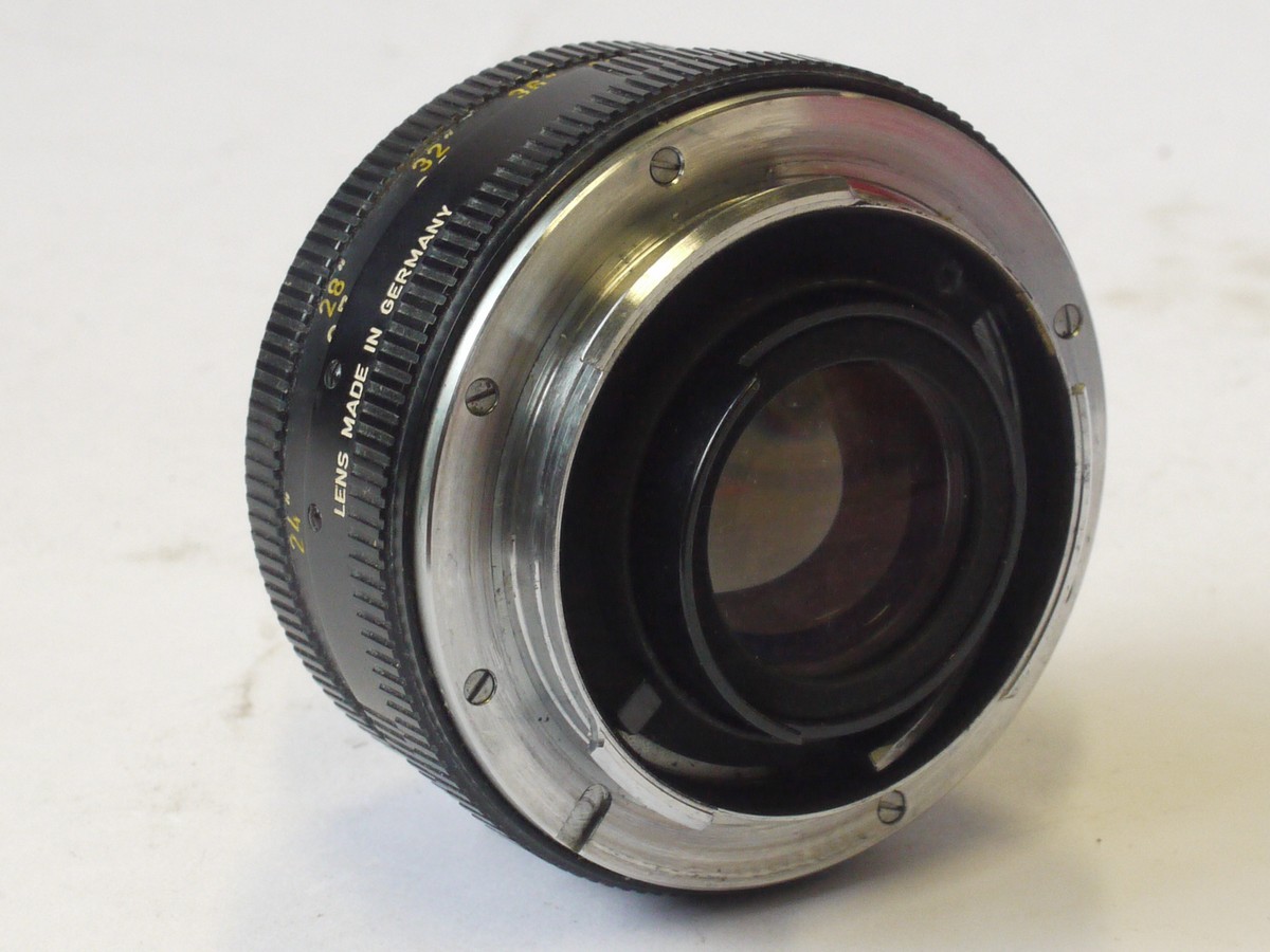 mwclassiccameras-20240517-31 Leitz Wetzlar 50mm f2 Summicron-R Single-Cam (No.2165029) + Leitz Series VI UVa filter with retaining ring (14160), Leitz Cip-on metal lens hood (12564), frtont cap & Leitz Non-matching numbered box with internal packaging