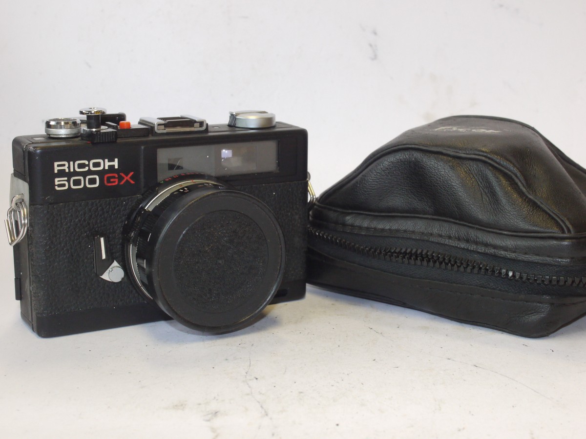 mwclassiccameras-20240531-197 Ricoh 500GX 35mm CDS metered coupled rangefinder camera, black, with 40mm f2.8 Rikenon lens + front cap & case. SUITABLE FOR SPARE PARTS/REPAIR