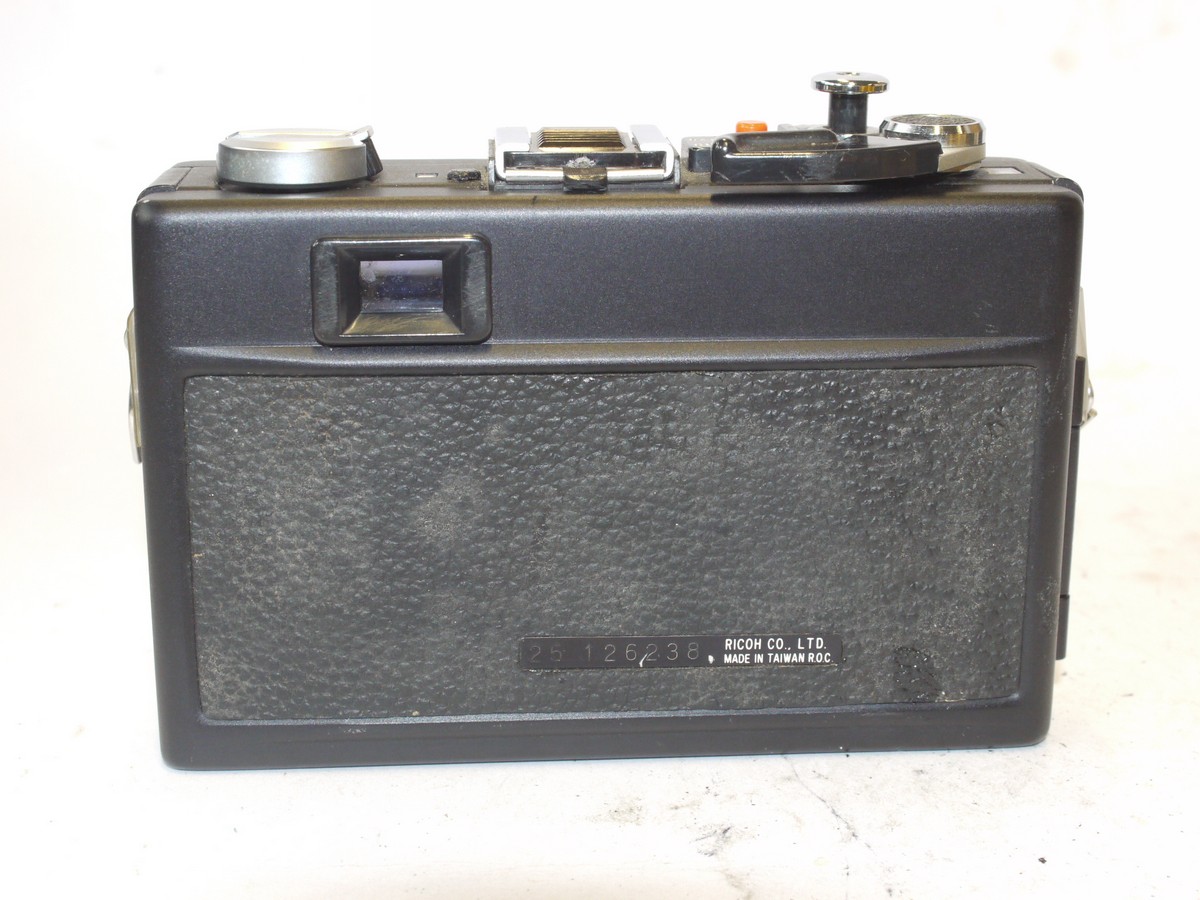 mwclassiccameras-20240531-199 Ricoh 500GX 35mm CDS metered coupled rangefinder camera, black, with 40mm f2.8 Rikenon lens + front cap & case. SUITABLE FOR SPARE PARTS/REPAIR