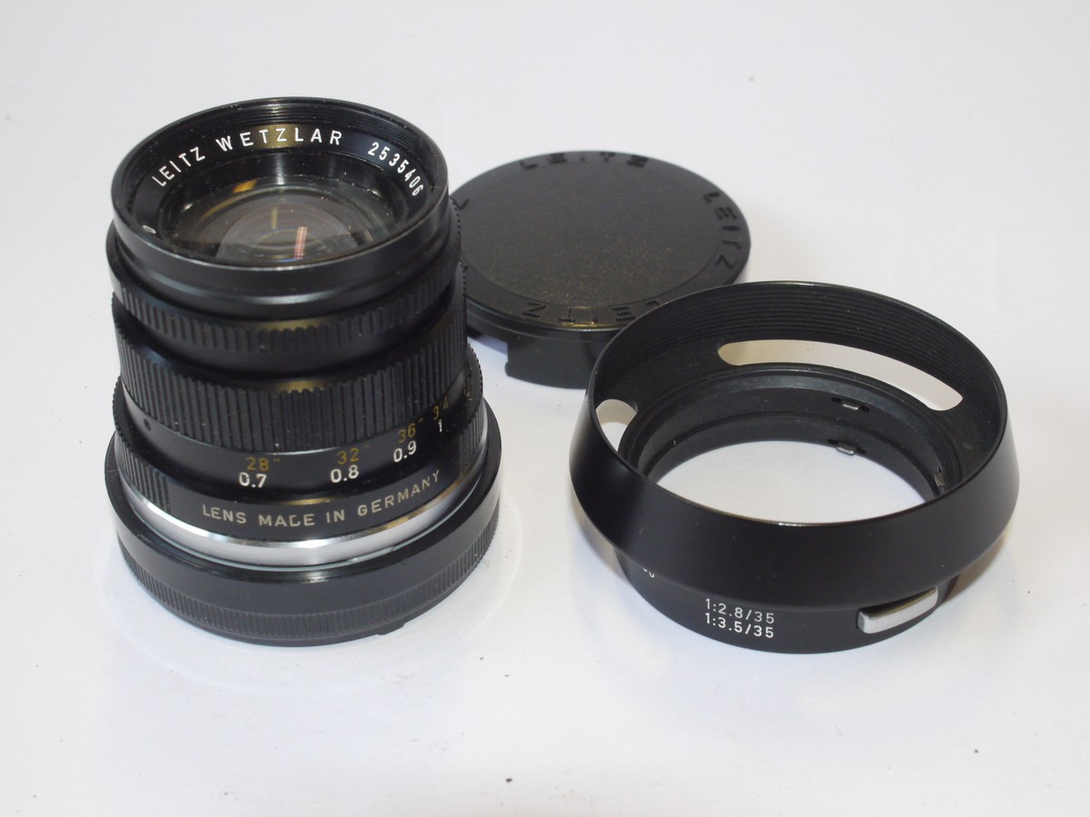 mwclassiccameras-20240607-37 Leitz Wetzlar 50mm f2 Summicron-M black Anodised barrel (No.2535406) c1972 Version III + Leitz Clip-on mwtal lens hood with vents (12585) & hood front cap