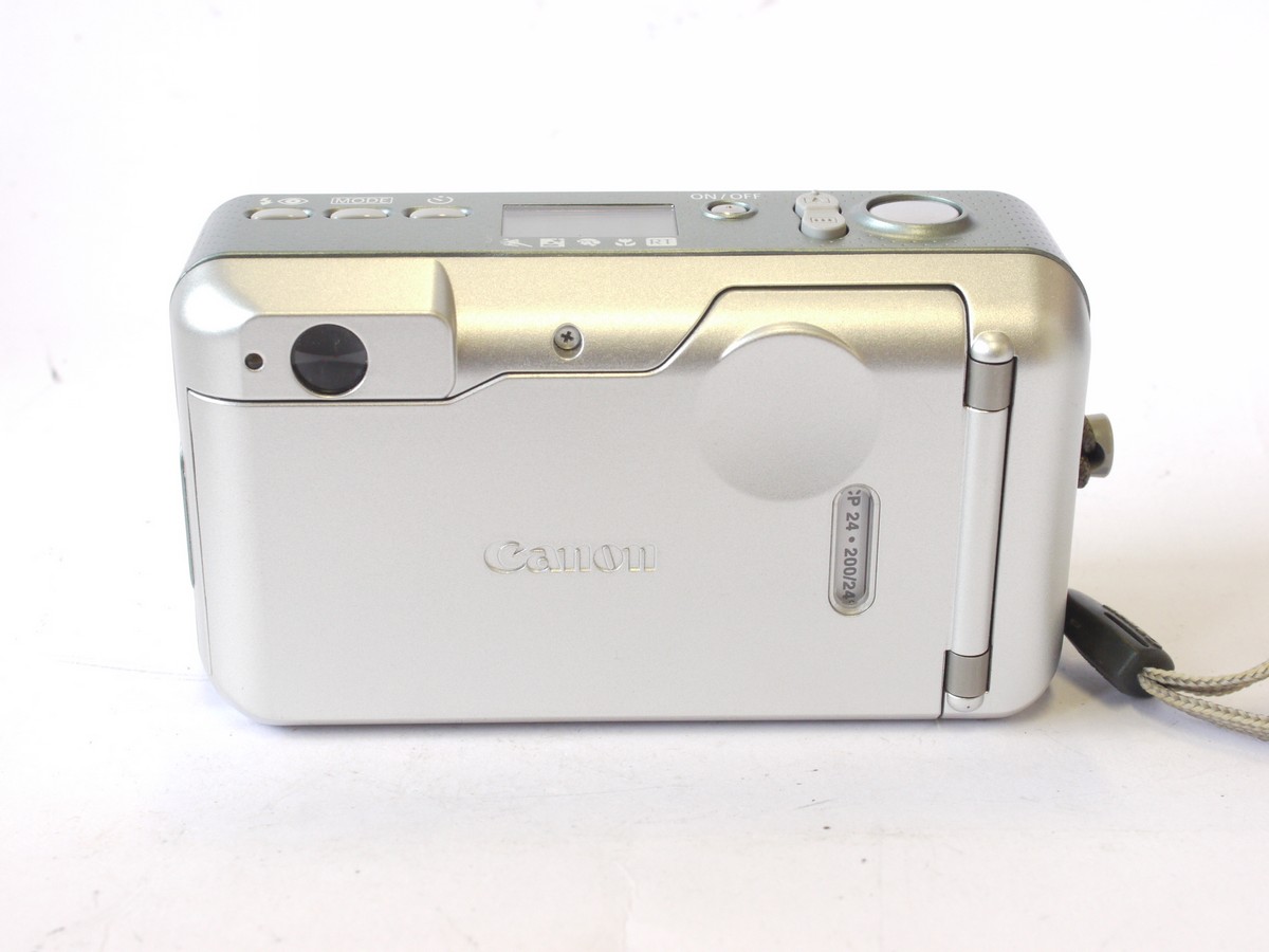 mwclassiccameras-20240712-158 Canon Sureshot 105u 35mm Compact Autofocus Point-&- Shoot camera, Silver coloured, with 38-105mm Zoom, wrist trap, Instructions, Acrylic Photo Frame & makers Box