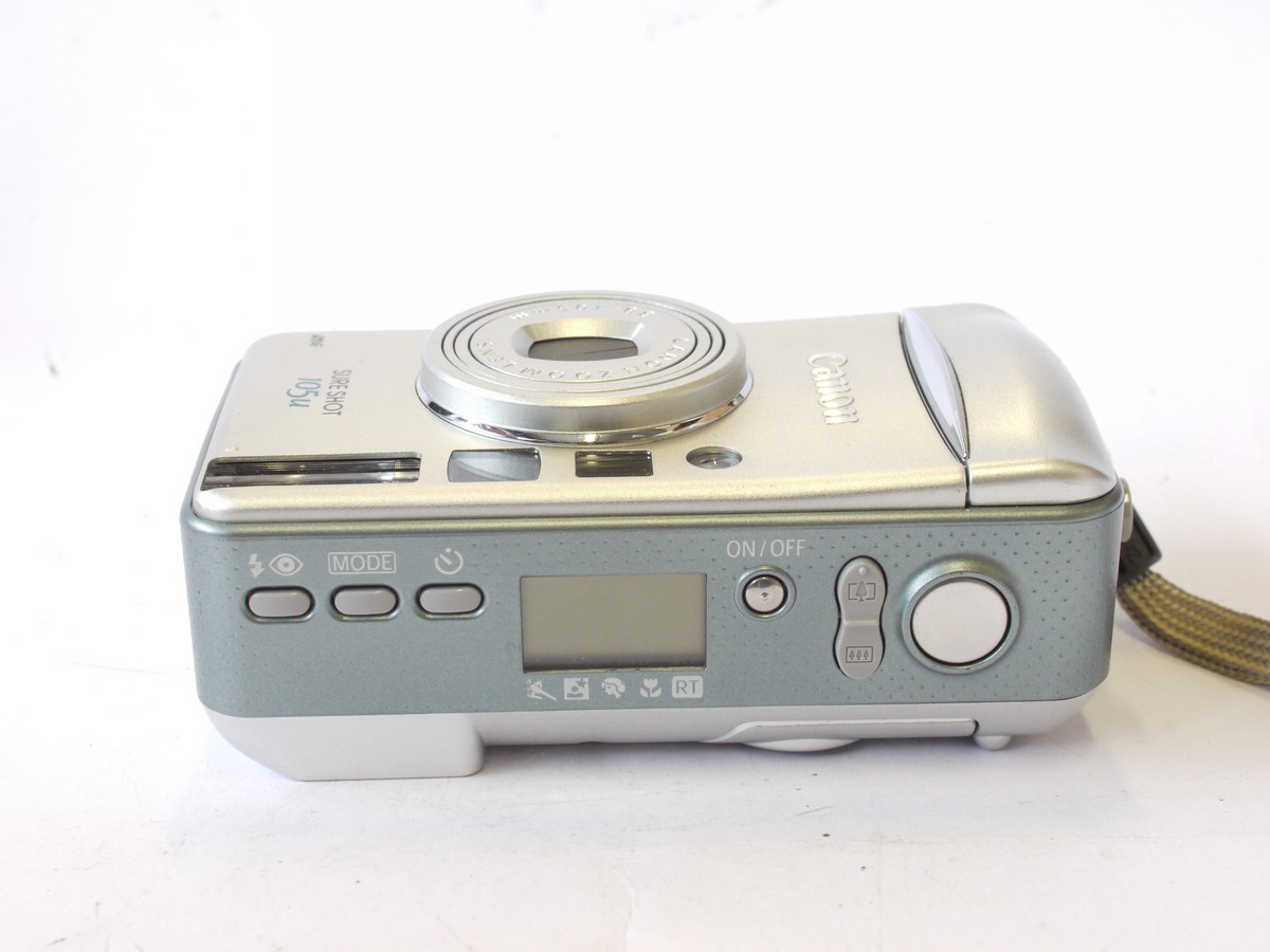 mwclassiccameras-20240712-159 Canon Sureshot 105u 35mm Compact Autofocus Point-&- Shoot camera, Silver coloured, with 38-105mm Zoom, wrist trap, Instructions, Acrylic Photo Frame & makers Box