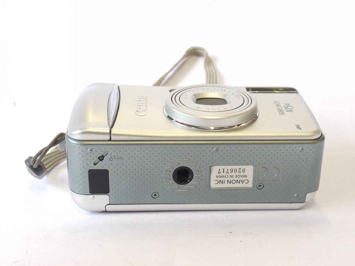 mwclassiccameras-20240712-160 Canon Sureshot 105u 35mm Compact Autofocus Point-&- Shoot camera, Silver coloured, with 38-105mm Zoom, wrist trap, Instructions, Acrylic Photo Frame & makers Box