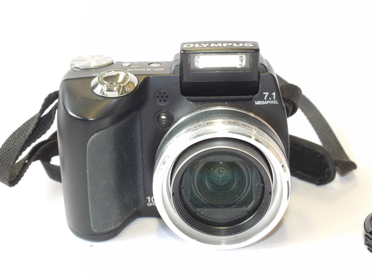 mwclassiccameras-20240712-24 Olympus SP-51OUZ 7.1MP Digital Bridge camera with 6.3-63mm f2.8-3.7 Zoom lens + front cap & strap