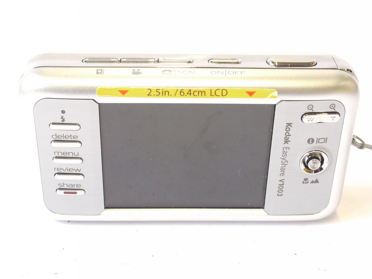 mwclassiccameras-20240712-59 Kodak Easyshare V1003 10MP Digital Compact Camera, Silver coloured, with 36-108mm Retinar Aspheric 3X Optical Zoom + Battery, strap
