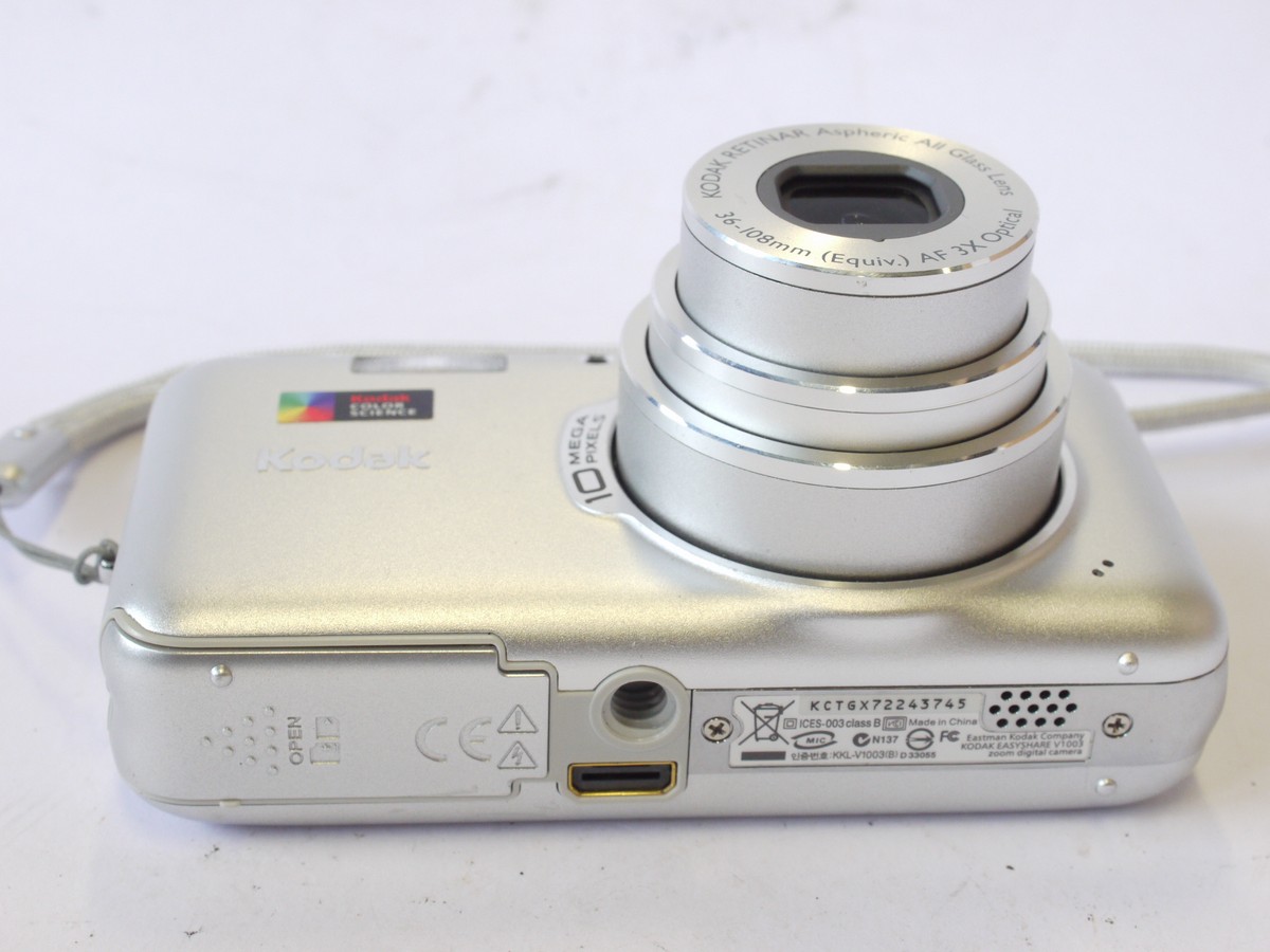 mwclassiccameras-20240712-61 Kodak Easyshare V1003 10MP Digital Compact Camera, Silver coloured, with 36-108mm Retinar Aspheric 3X Optical Zoom + Battery, strap