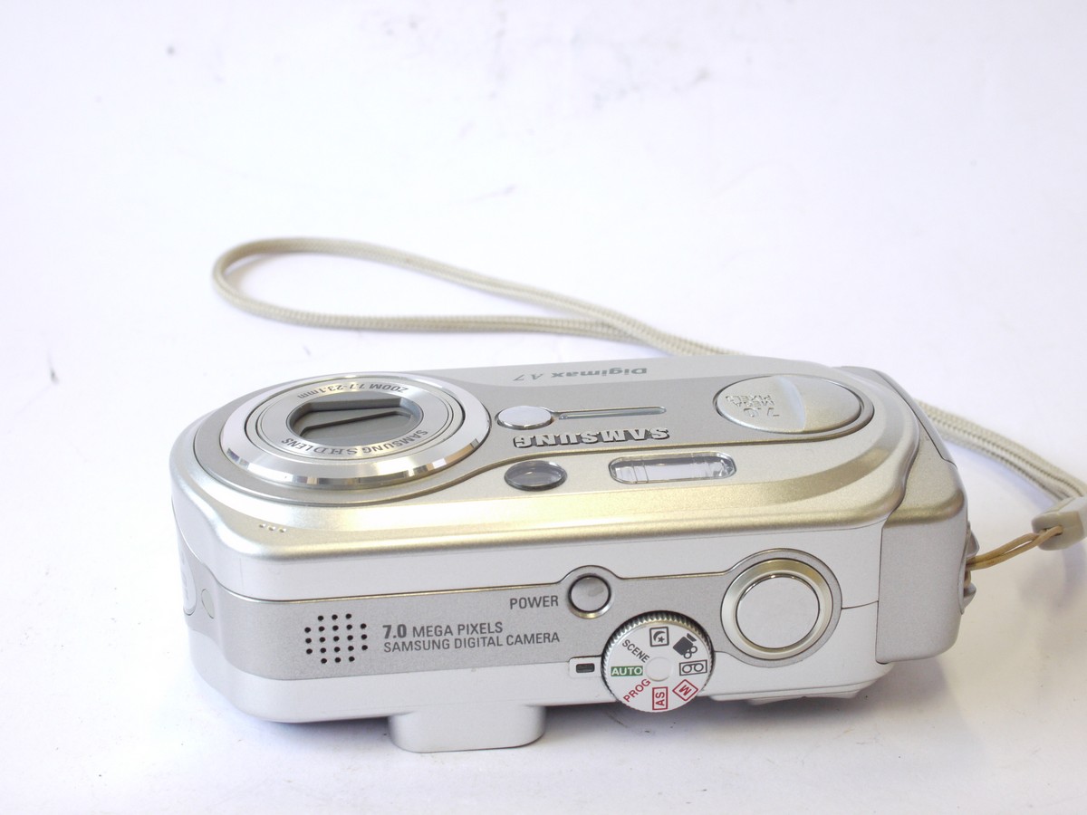 mwclassiccameras-20240712-65 Samsung Digimax A7 7MP Digital Compact Camera, Silver Coloured, with 7.7-23.1mm Zoom lens + wrist strap & Instructions. No Battery or Charger