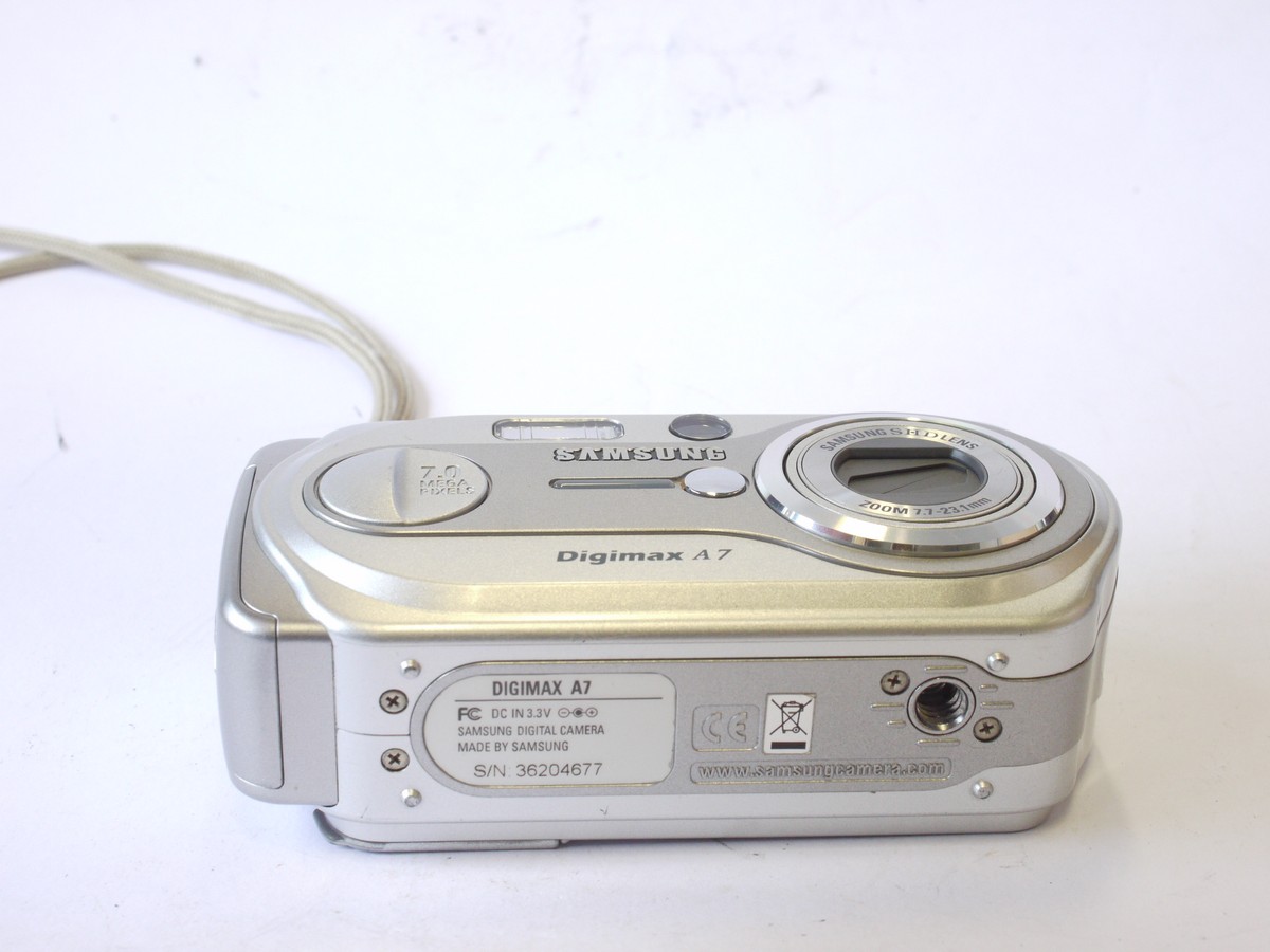 mwclassiccameras-20240712-66 Samsung Digimax A7 7MP Digital Compact Camera, Silver Coloured, with 7.7-23.1mm Zoom lens + wrist strap & Instructions. No Battery or Charger