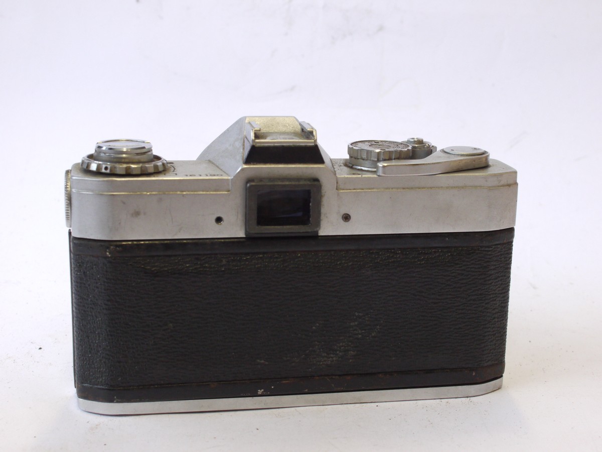 mwclassiccameras-20240719-142 Canon Pellix QL 35mm SLR, chrome + Canon 50mm f1.8 FD lens. Features through-the-mirror mechanism with mirror not rising when taking pictures. FOR RESTORATION/SPARE PARTS