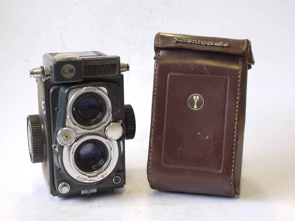 mwclassiccameras-20240802-148 Yashica 44 LM 4x4 in 127 TLR, Grey body with Light Grey covering, with 60mm f3.5 Yashinon lens in Copal-SV shutter + Brown ER case