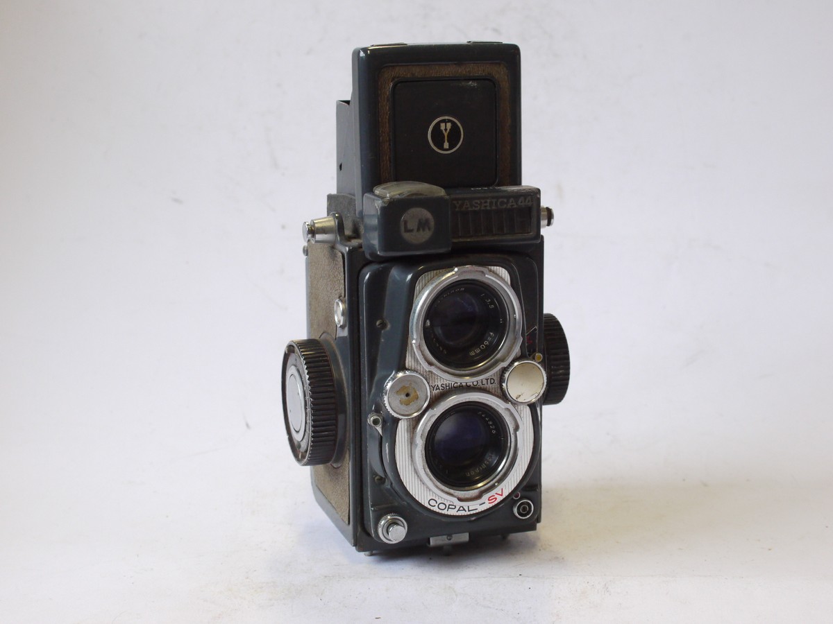 mwclassiccameras-20240802-149 Yashica 44 LM 4x4 in 127 TLR, Grey body with Light Grey covering, with 60mm f3.5 Yashinon lens in Copal-SV shutter + Brown ER case