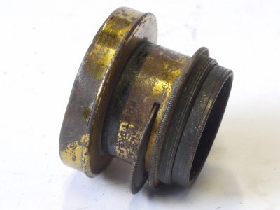 Photo-Port Paris 2-3 inch (Estimated) Grand Angle (Wide Angle) brass lens with rotating wheel apertures & scree-in brass lens hood. Lens engraved 8x12 (Coverage)