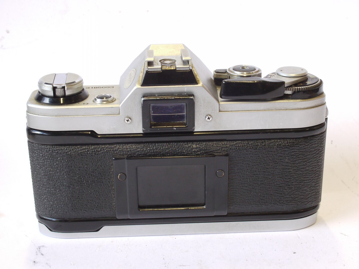 mwclassiccameras-20240816-41 Canon AE-1 35mm SLR body, chrome. Battery cover has broken off. UNTESTED