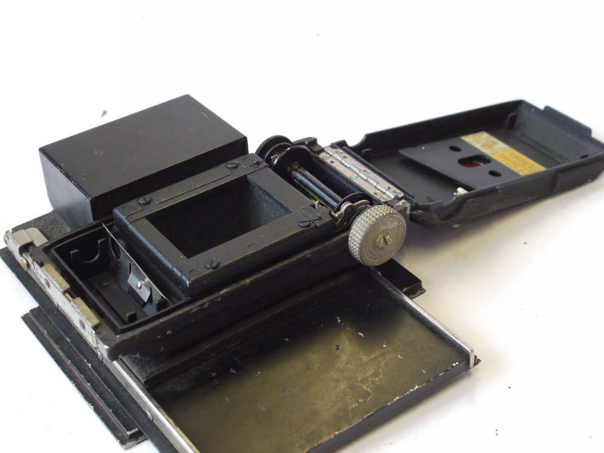 mwclassiccameras-20240816-5 Kodak 6x9 folding plate camera (made by Nagel) + 35mm film back with built-in Miniature Kodachrome Adapter on a large rear panel. (Panel moves sideways for focusing on ground glass. With 105mm f4.5 Anastigmat lens in Compur shutter. UNCOMMON BACK