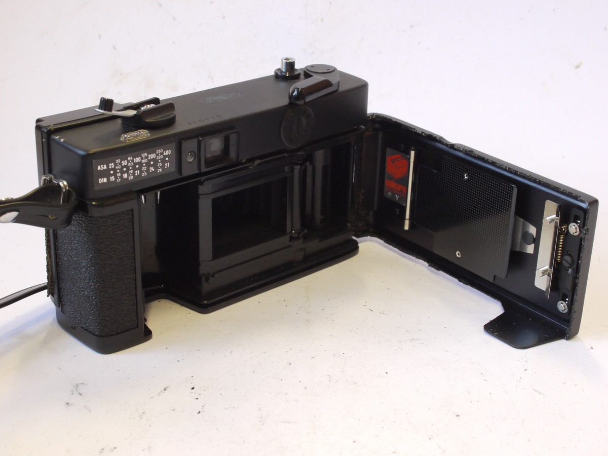 mwclassiccameras-20240823-105 Konica C35 EF 35mm Zone-Focus camera with 38mm f2.8 Hexanon lens + front cap & Neck Strap. Takes AA Batteries