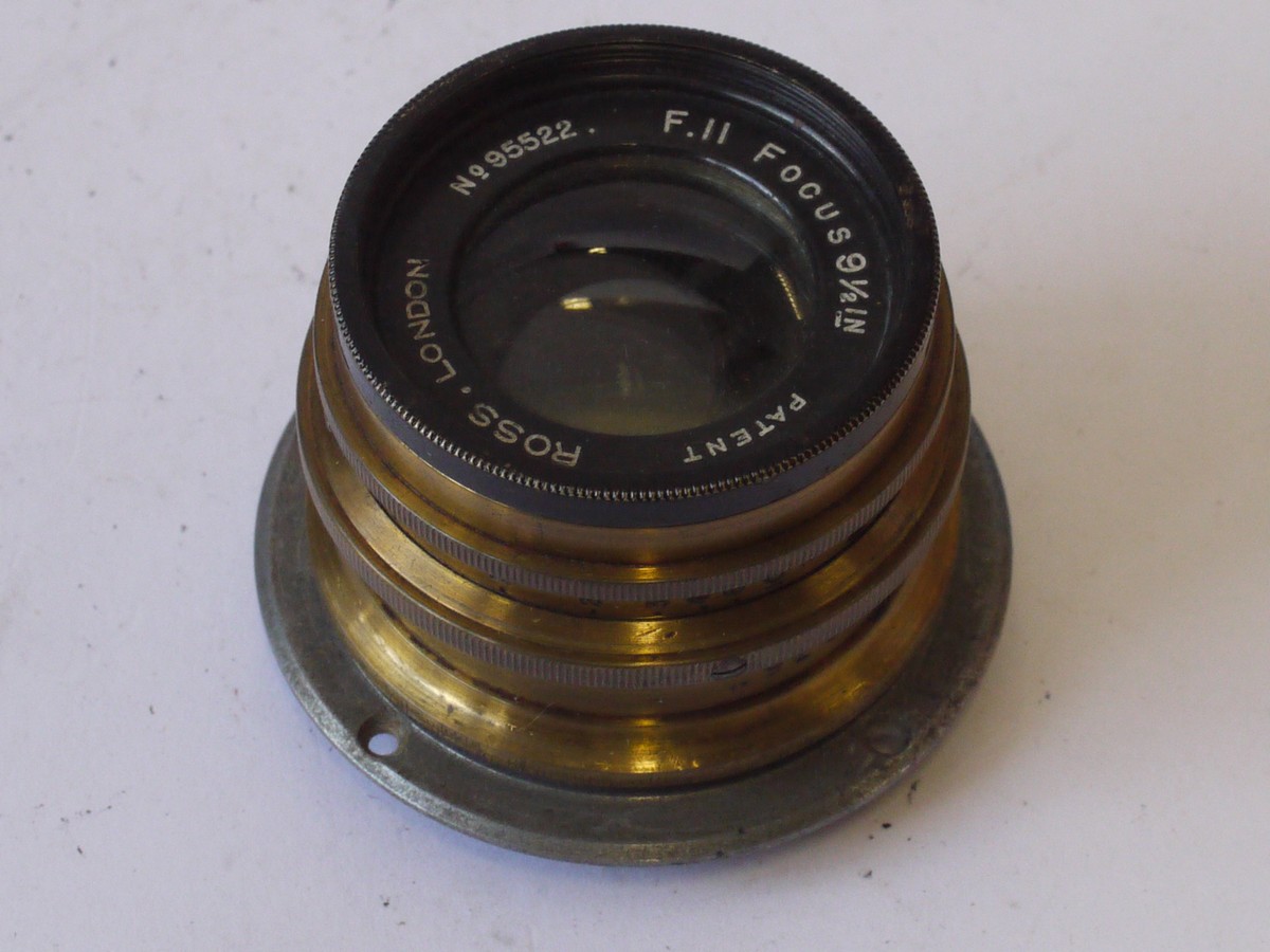 mwclassiccameras-20240823-15 Ross London Combinable Brass lens "S.R.E No. J2786" with Iris Diaphragm & flange. Consists of 9 1/2 inch f11 & 10 1/4 inch f11 lenses. With leather case