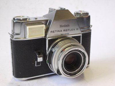 Kodak Retina Reflex III 35mm Selenium metered SLR + Schneider 50mm f2.8 Retina-Xenar Deckel mount lens with meter diffuser cover, 7 x filter Set (OL Skylight, R:1:2, R:1:4.5, NI & NII close-Ups, Portra 1 & Portra 2 Close-ups), Data Guide Booklet & Kodak leather outfit case
