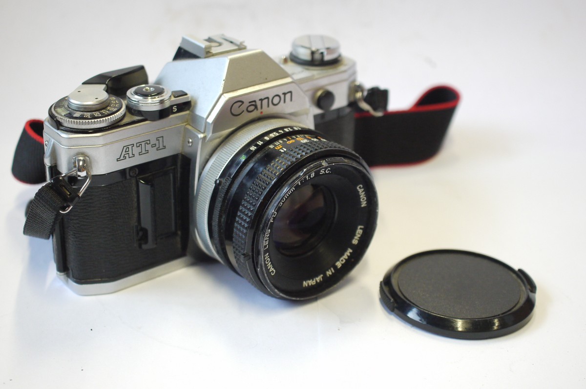 mwclassiccameras-20240906-145 Canon AT-1 35mm SLR, chrome + Canon 50mm f1.8 FD Breechlock mount lens, front cap & neck strap