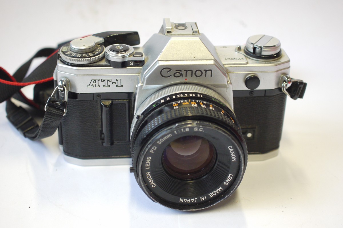 mwclassiccameras-20240906-146 Canon AT-1 35mm SLR, chrome + Canon 50mm f1.8 FD Breechlock mount lens, front cap & neck strap