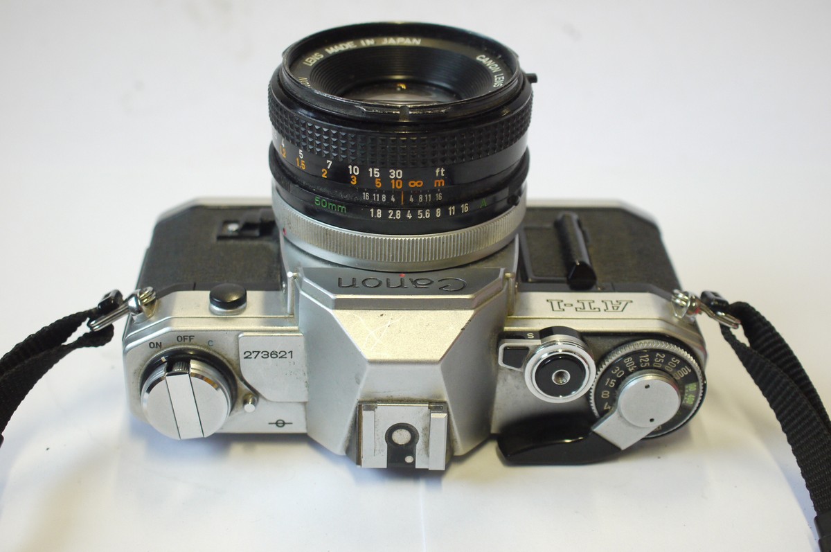 mwclassiccameras-20240906-148 Canon AT-1 35mm SLR, chrome + Canon 50mm f1.8 FD Breechlock mount lens, front cap & neck strap