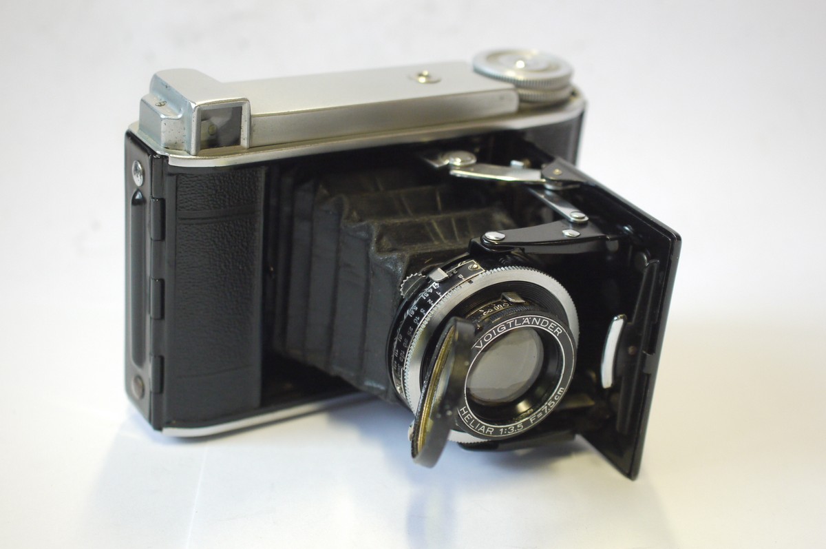 mwclassiccameras-20240906-20 Voigtlander Bessa 66 folding camera with 75mm f3.5 Heliar lens in Compur shutter, with hinging Yellow moment filter