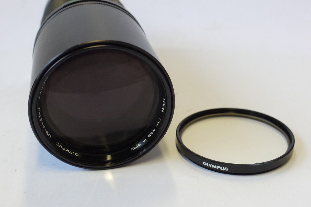mwclassiccameras-20240913-39 Olympus 300mm f4.5 F Zuiko Auto-T manual focus OM mount lens with tripod mount & built-in lens hood & Olympus UV filter & rear cap