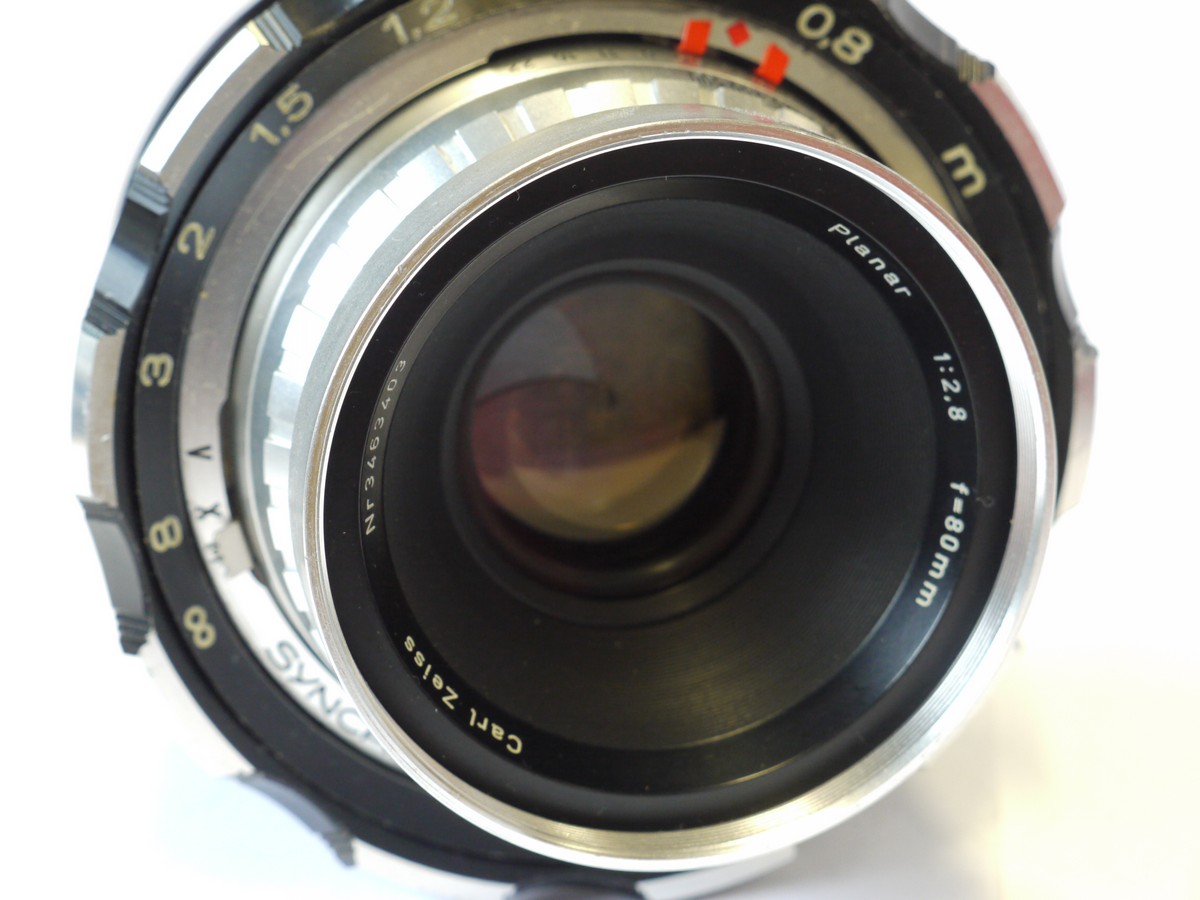 mwclassiccameras-20240927-235 Linhof Press 70 Selenium metered coupled rangefinder camera, with 56x72mm Super Rollex film back, Anatomical Grip with cable release & Carl Zeiss 80mm f2.8 Planar lens in Synchro Compur shutter, with front cap
