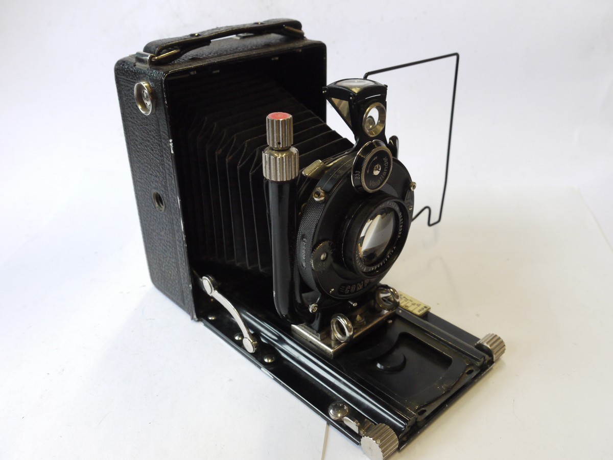 mwclassiccameras-20240927-301 Voigtlander Bergheil 6x9 folding plate camera, all black, with ground glass back & 12cm f4.5 Heliar interchangeable bayonet mount lens + leather case