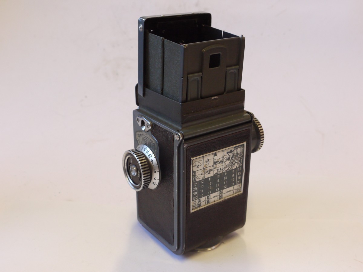 mwclassiccameras-20241004-118 Rolleiflex Baby Grey 4x4 TLR, Grey, recovered with black letherette covering, with Schneider 60mm f3.8 Xenar lens in Synchro Compur shutter