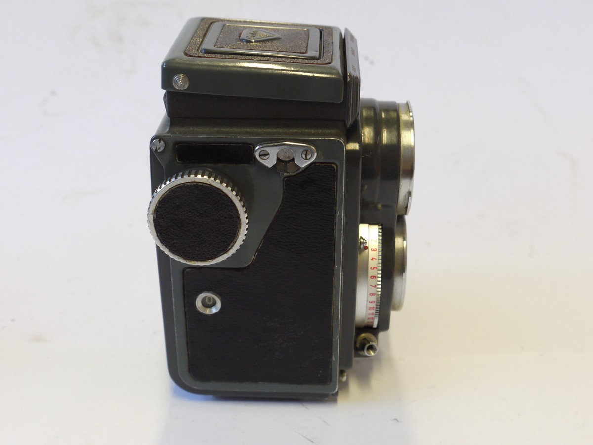 mwclassiccameras-20241004-122 Rolleiflex Baby Grey 4x4 TLR, Grey, recovered with black letherette covering, with Schneider 60mm f3.8 Xenar lens in Synchro Compur shutter