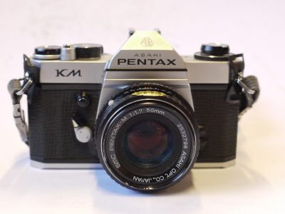 Pentax KM 35mm SLR, chrome + 50mm f1.7 SMC Pentax-M PKM mount lens, neck strap & ER case
