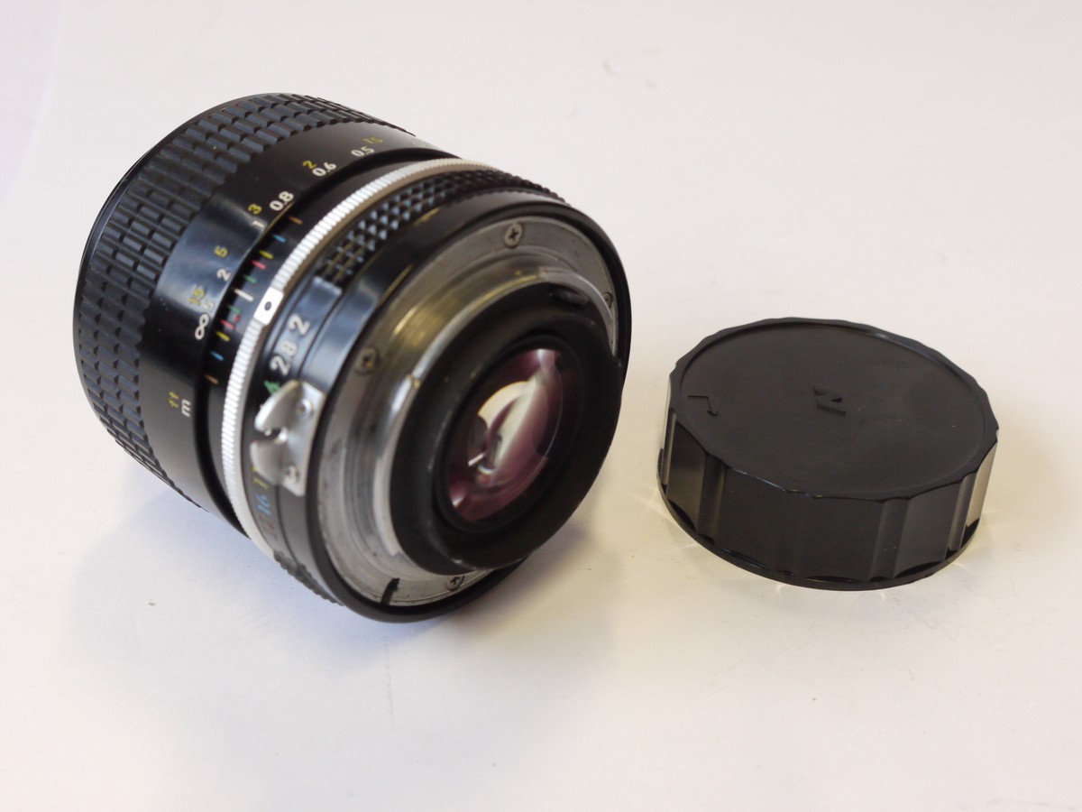 mwclassiccameras-20241011-176 Nikon 28mm f2 Nikkor manual focus PRE-AI mount lens, later/modern type + caps