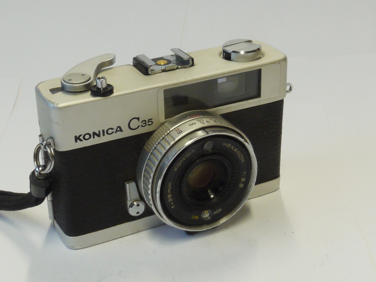 mwclassiccameras-20241025-236 Konica C35 35mm CDS metered Auto Exposure coupled rangefinder camera, chrome, with 38mm f2.8 Hexanon lens + Wrist Strap & Instructions. NON-WORKING