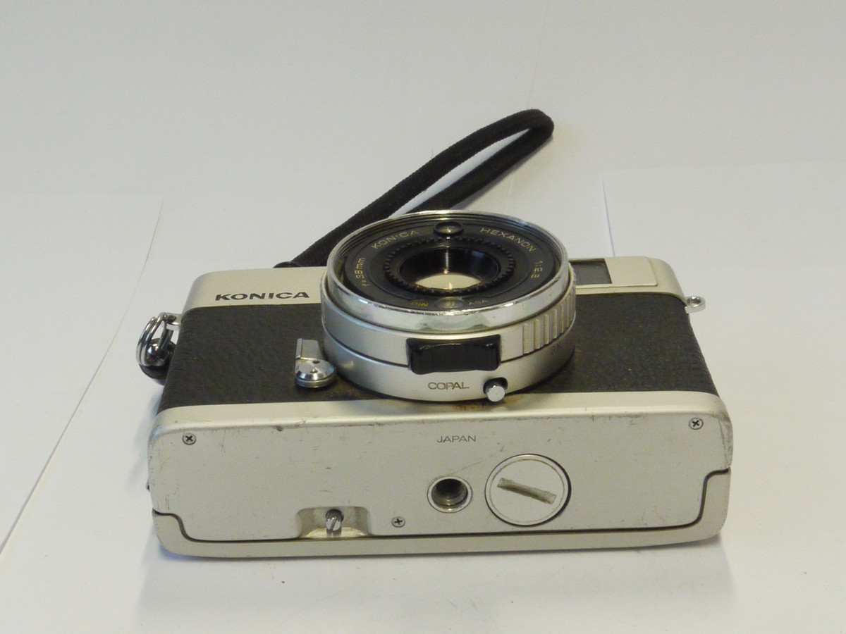 mwclassiccameras-20241025-241 Konica C35 35mm CDS metered Auto Exposure coupled rangefinder camera, chrome, with 38mm f2.8 Hexanon lens + Wrist Strap & Instructions. NON-WORKING