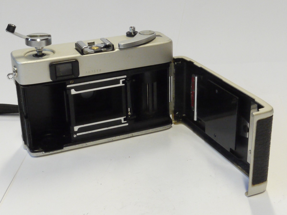 mwclassiccameras-20241025-242 Konica C35 35mm CDS metered Auto Exposure coupled rangefinder camera, chrome, with 38mm f2.8 Hexanon lens + Wrist Strap & Instructions. NON-WORKING
