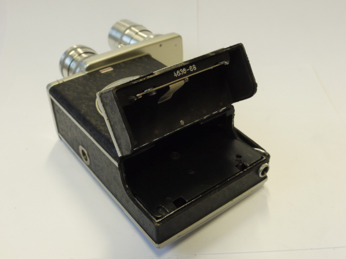 mwclassiccameras-20241108-285 Kiev 16C-3 16mm Spring Motored Cine camera (taking Drop-in 16mm Catridge film) with 20mm f2.8 PO-51 & 50mm f3.5 Industar-50 C mount lens on a Trin-Turret + Two Film Cartridges, Pistol Grip & Outfit case. UNCOMMON