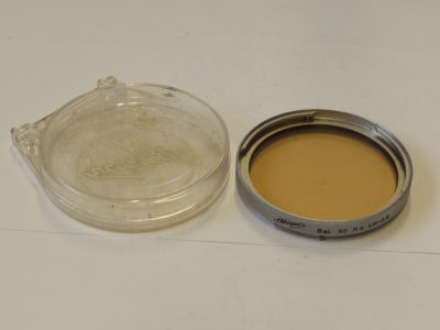 Heliopan B60 Bayonet R6 LW-0.5 Light Amber/Skylight filter, chrome rim + Keeper case. For Hasselblad