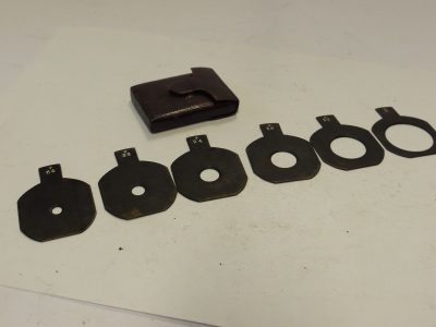 Optimus Waterhouse stops set of Six Metal Stops, f8 to f44 (35x35mm) with end handle grips, in "Optimus" brown leather case