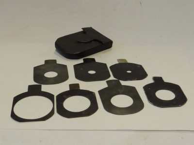 Unamed Waterhouse stops Two sets of Metal Stops. Four stops marked f6, f8, f11 & f16 (60x47mm) + Unmaerked set of three different stops (54x48mm). All with end handle grips in one Green leather case
