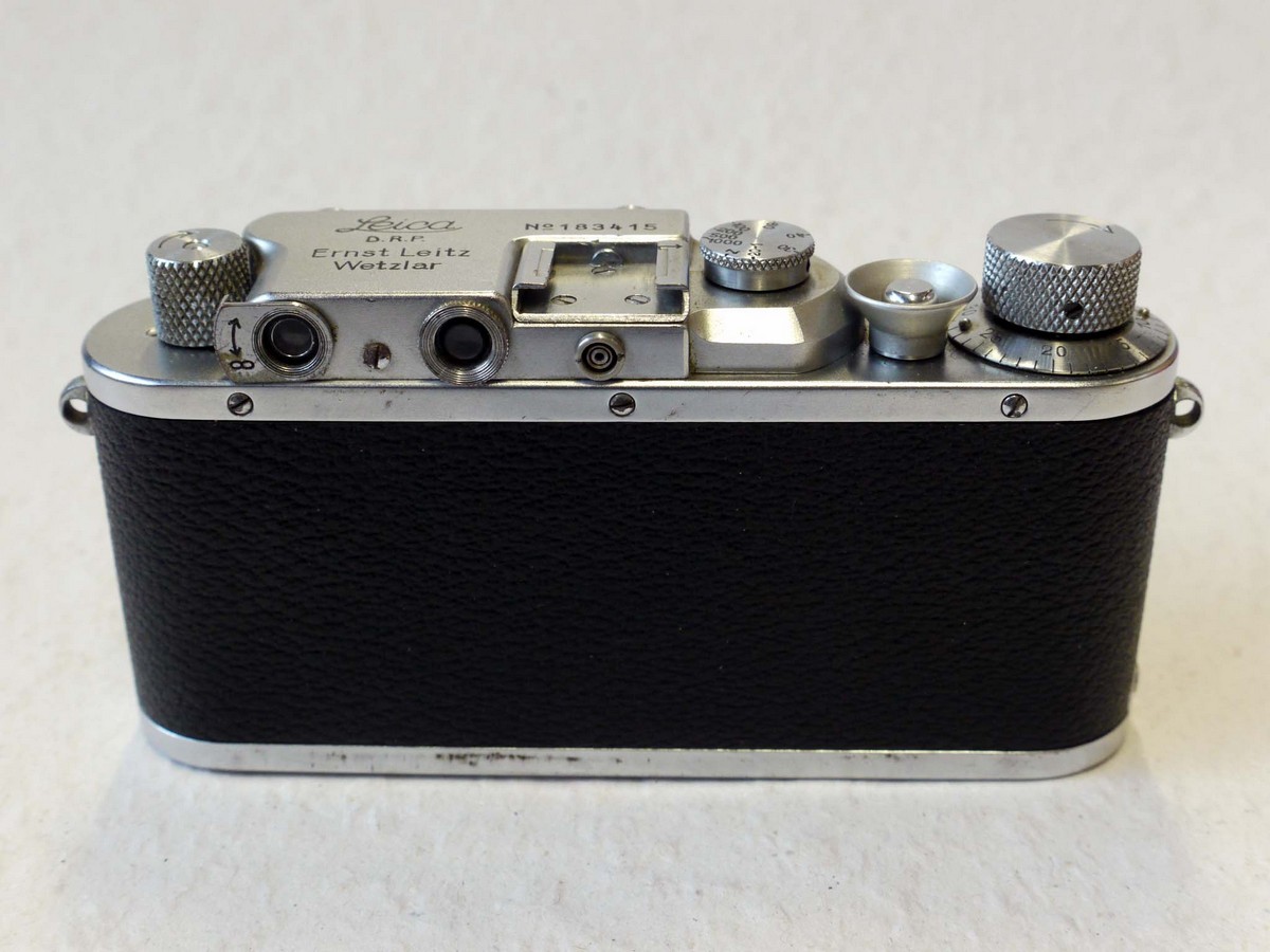 mwclassiccameras-20241206-135 Leica IIIa chrome (No.183415) with correctly added flash synch on top rear + 5cm f2 Summar chrone lens with black front face (No.210600). Complete with R G Lewis UK HM Customs Certificate with correctly marked serial numbers c1938