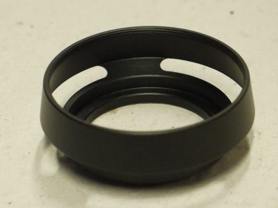 Unamed 39mm screw-in black metal circular lens hood with vents for use with rangefinder (Leica) cameras