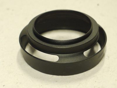 Unamed 39mm screw-in black metal circular lens hood with vents for use with rangefinder (Leica) cameras