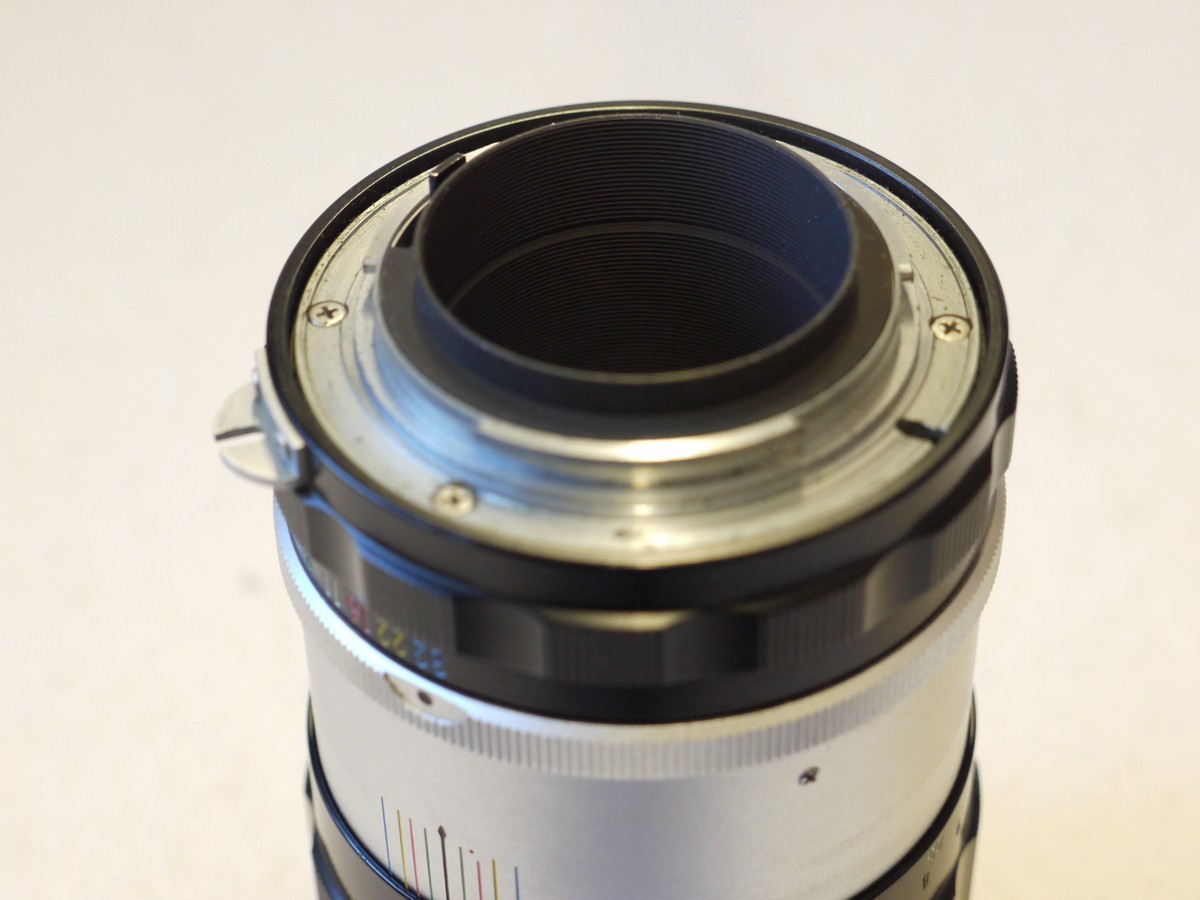 mwclassiccameras-20241219-68 Nikon 135mm f3.5 Nikkor-Q.C black & chrome PRE-AI mount lens + HS-4 metal lens hood & rear cap
