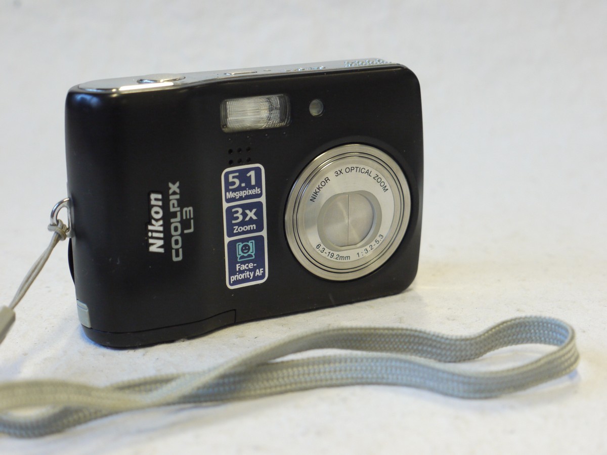 mwclassiccameras-20250110-21 Nikon Coolpix L3 5.1MP Digital Compact Camera, Black, with 6.3-19.2mm f3.2-5.6 3X Optical Zoom + Strap. Takes SD Cards & AA Batteries