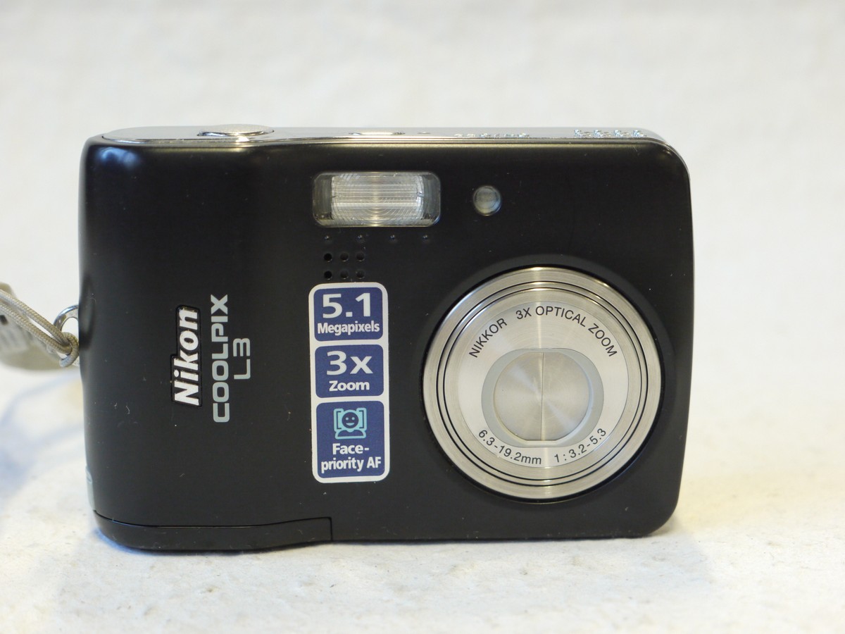 mwclassiccameras-20250110-22 Nikon Coolpix L3 5.1MP Digital Compact Camera, Black, with 6.3-19.2mm f3.2-5.6 3X Optical Zoom + Strap. Takes SD Cards & AA Batteries