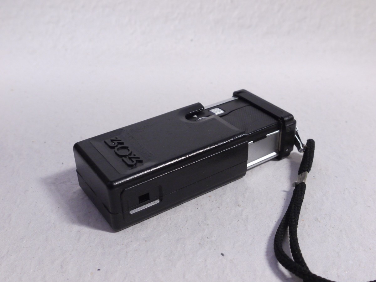 mwclassiccameras-20250117-16 Kiev 303 black 16mm Subminiature camera with case, strap, film with container, unused film, Developing tank/spool, instructions in Cyrillic & outfit Box