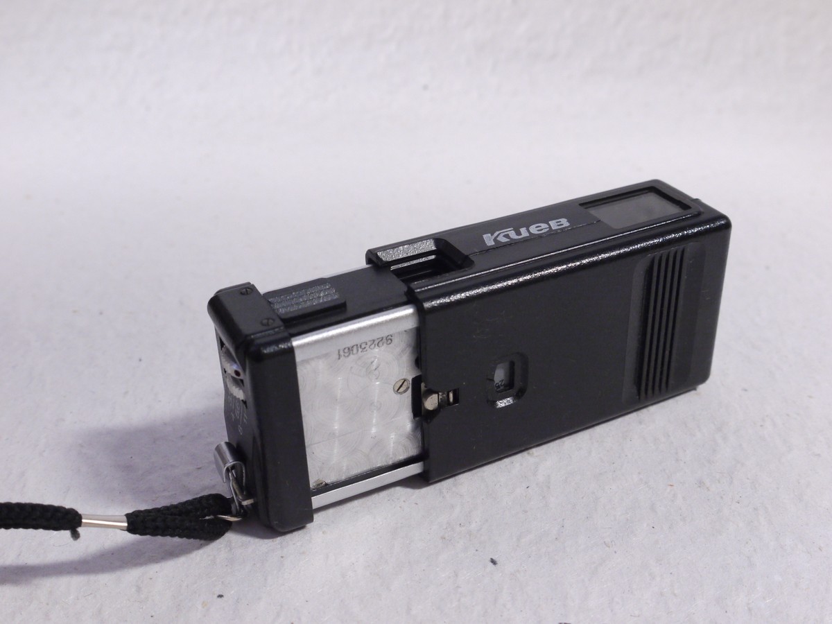 mwclassiccameras-20250117-17 Kiev 303 black 16mm Subminiature camera with case, strap, film with container, unused film, Developing tank/spool, instructions in Cyrillic & outfit Box
