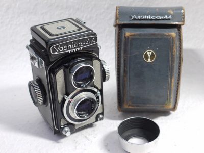 Yashica-44 127 TLR, 4x4, Dark Grey body with light grey covering, with 60mm f3.5 Yashikor lens in Copal shutter + Chrome push-on lens hood in Grey Yashica case & Grey leather Camera ER case with strap