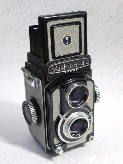 Yashica-44 127 TLR, 4x4, Dark Grey body with light grey covering, with 60mm f3.5 Yashikor lens in Copal shutter + Chrome push-on lens hood in Grey Yashica case & Grey leather Camera ER case with strap