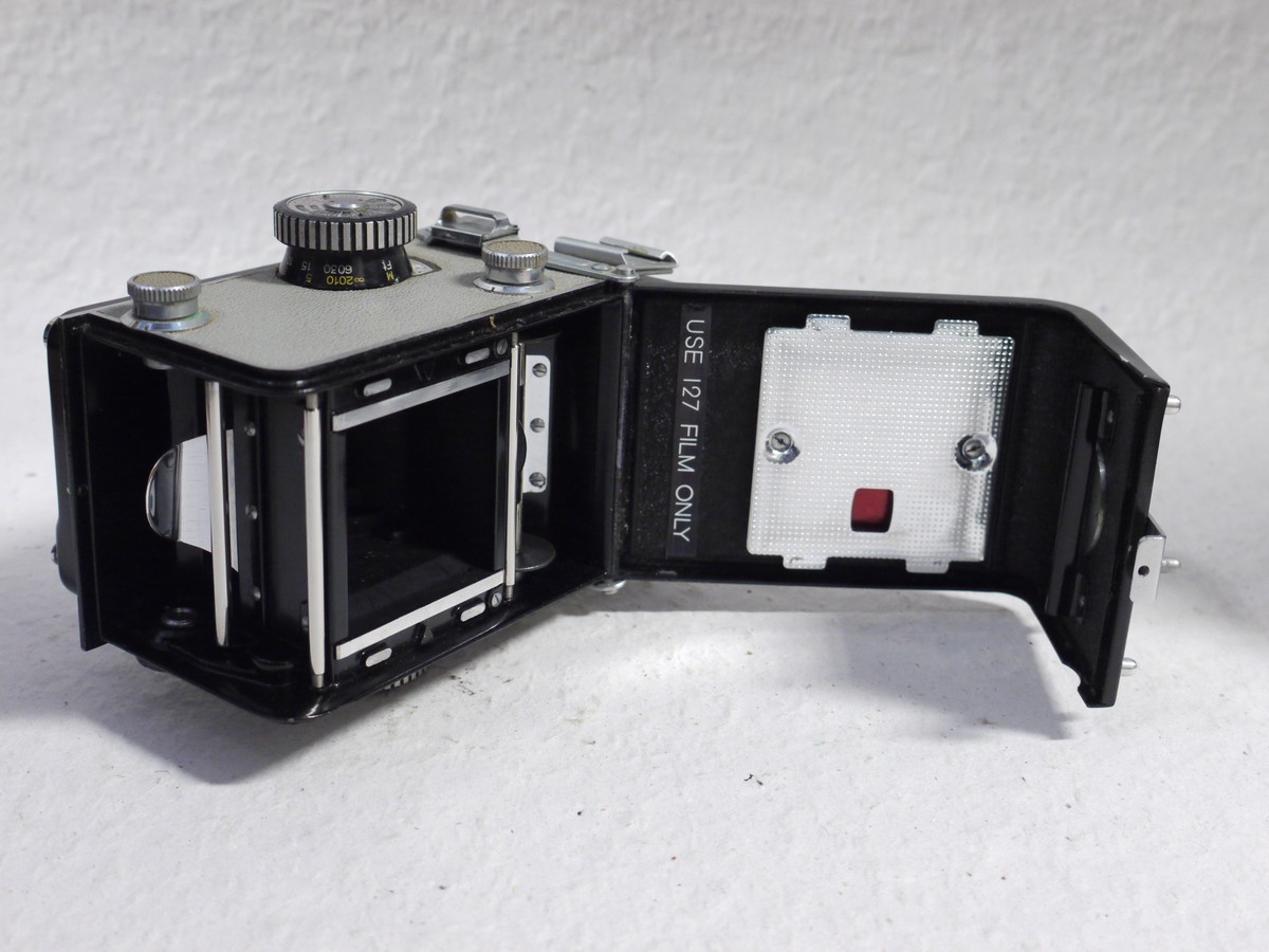 mwclassiccameras-20250124-133 Yashica-44 127 TLR, 4x4, Dark Grey body with light grey covering, with 60mm f3.5 Yashikor lens in Copal shutter + Chrome push-on lens hood in Grey Yashica case & Grey leather Camera ER case with strap